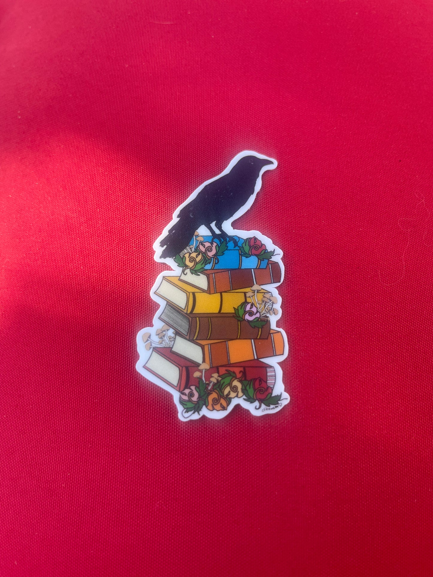 Crow on Stack of Books Sticker – Whimsical Literary Design