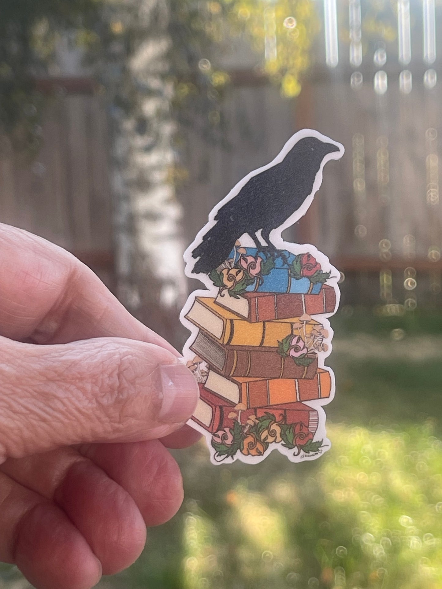 Crow on Stack of Books Sticker – Whimsical Literary Design