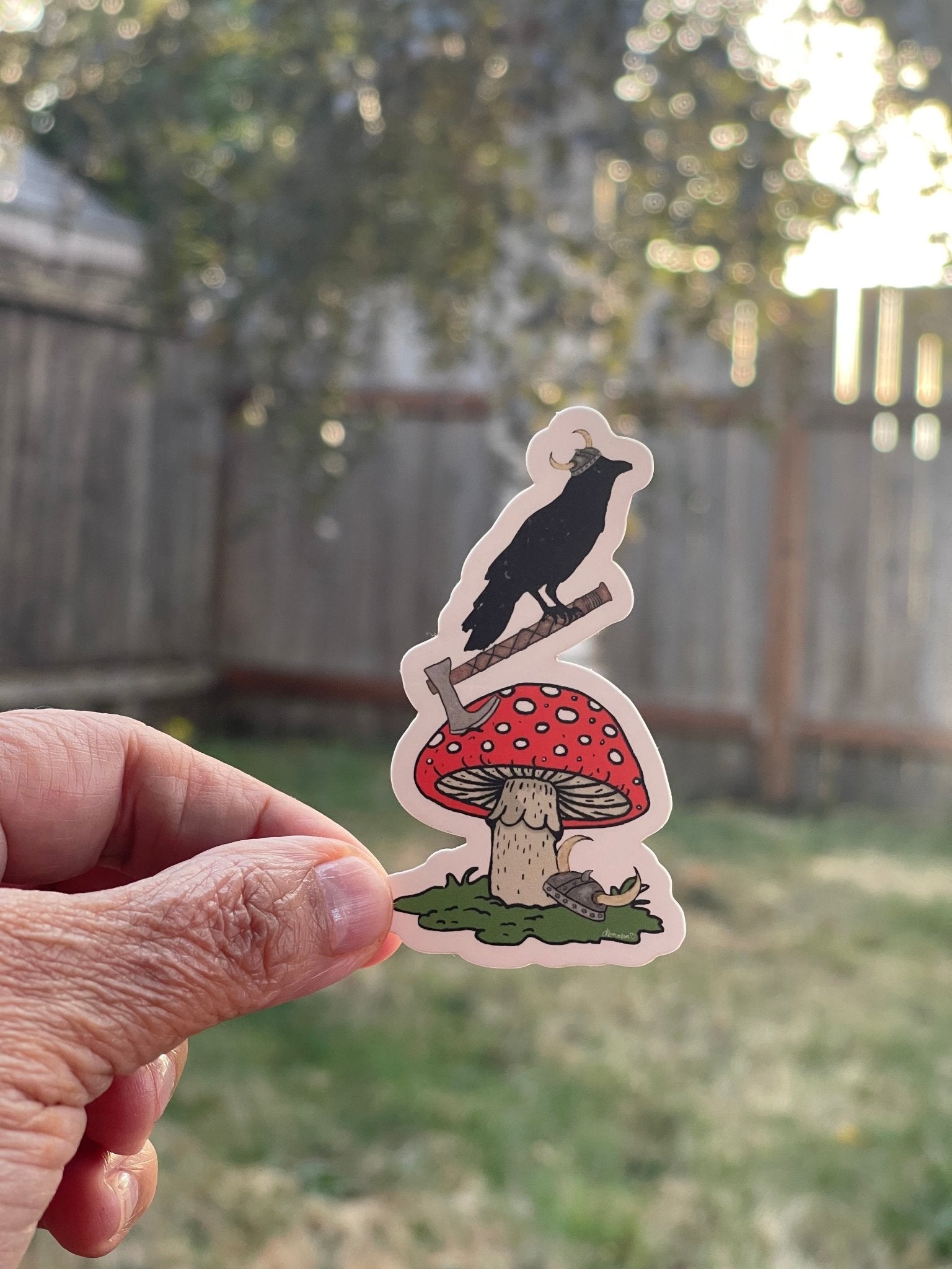 Amanita Mushroom Sticker with Axe and Crow – Red Toadstool Whimsical Forest Vinyl Decal - Color Crumbs Club