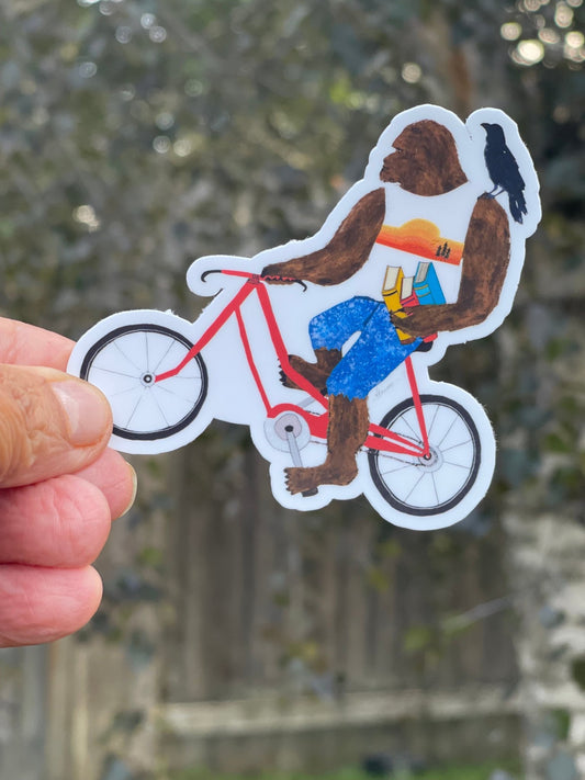 Bigfoot on Bike Sticker with Books and Crow – Whimsical Sasquatch Vinyl Decal Die Cut Sticker - Color Crumbs Club